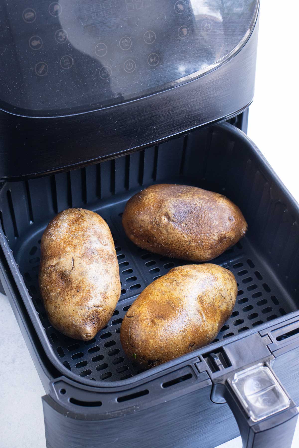 Place potatoes in an air fryer in a single layer.
