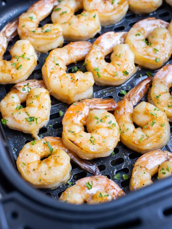 Season shrimp with lemon and parsley after air frying.