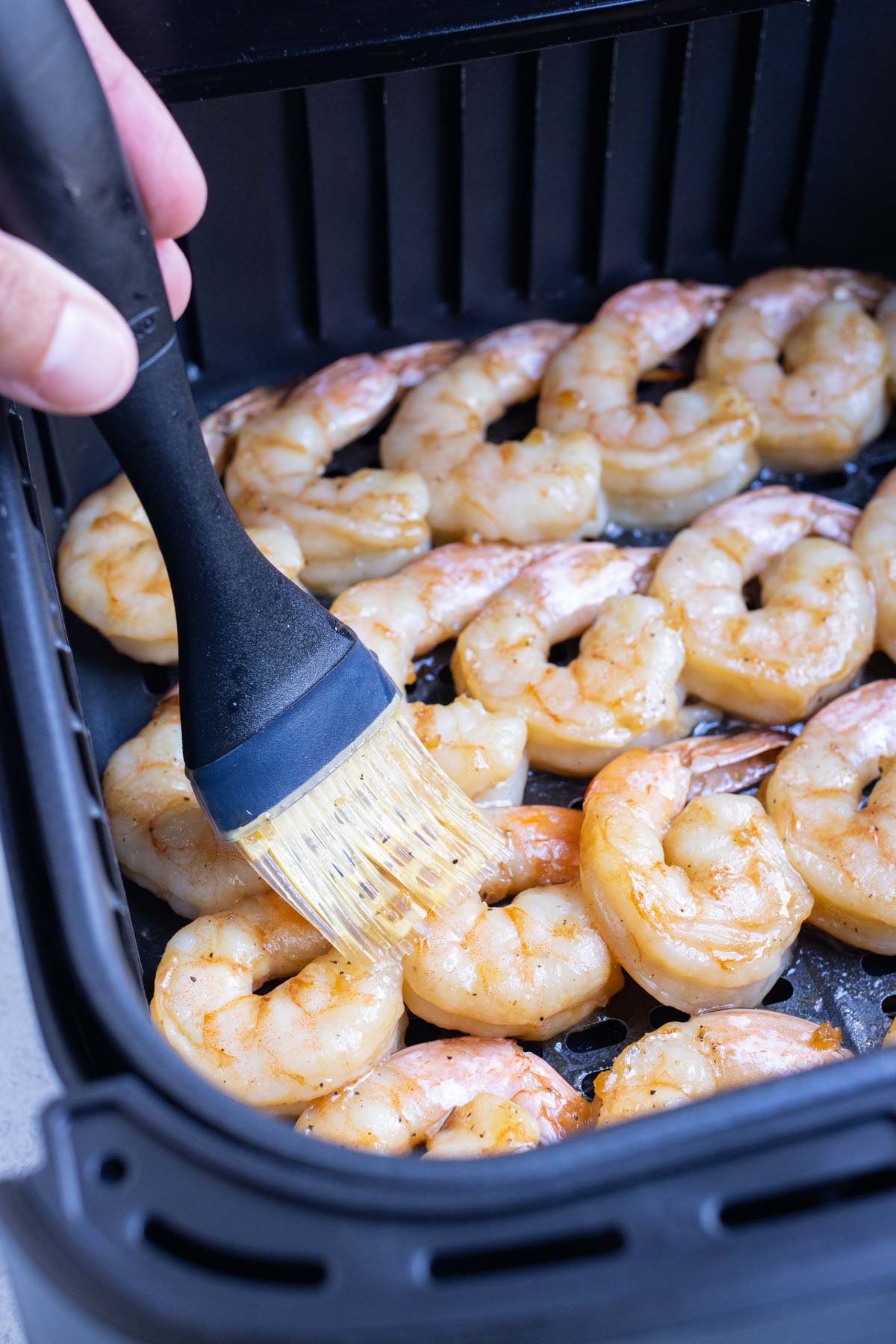 For the best flavor, shrimp is basted halfway through cooking.