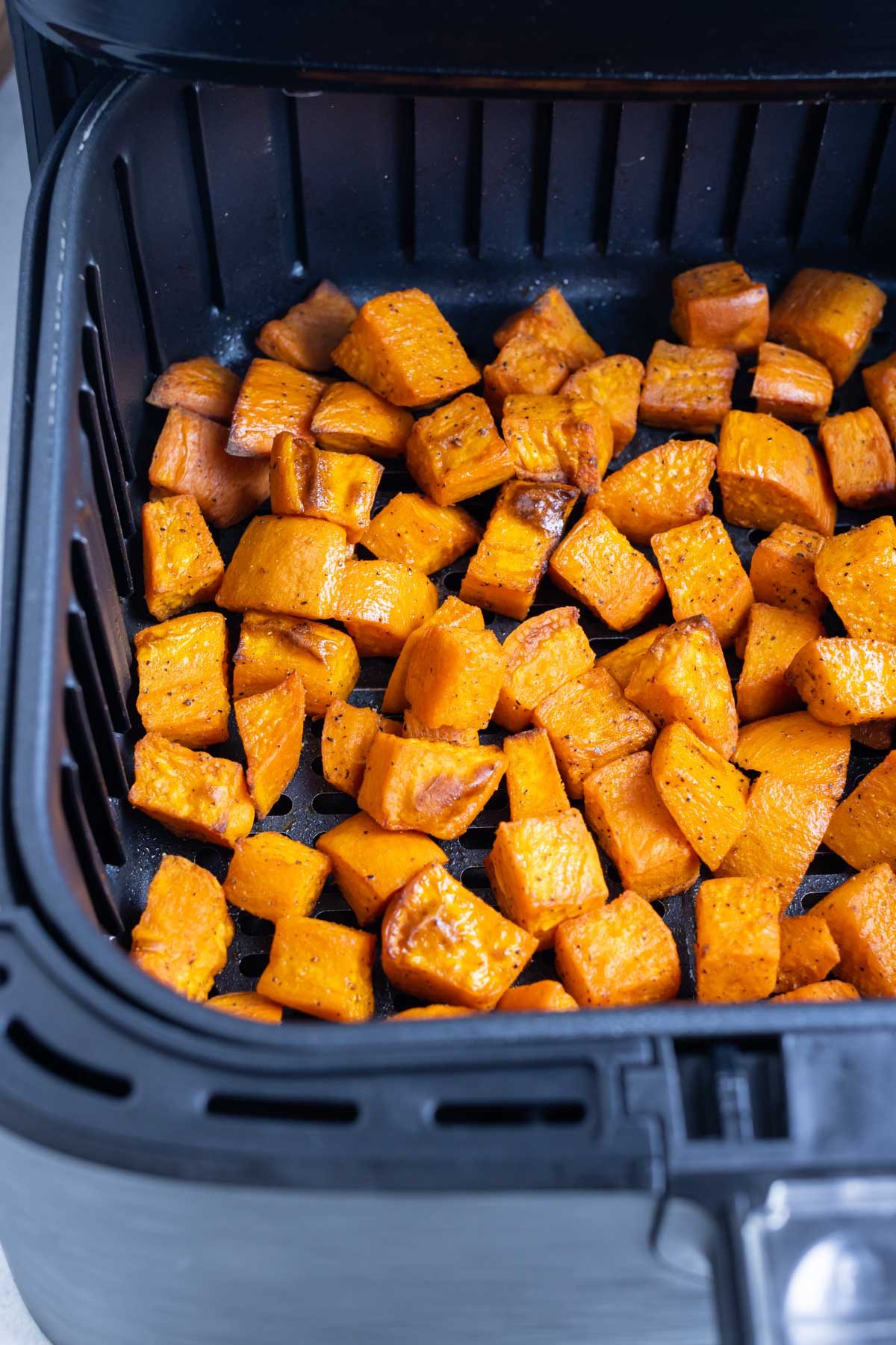 Quick and easy seasoned sweet potatoes cooked in the air fryer.