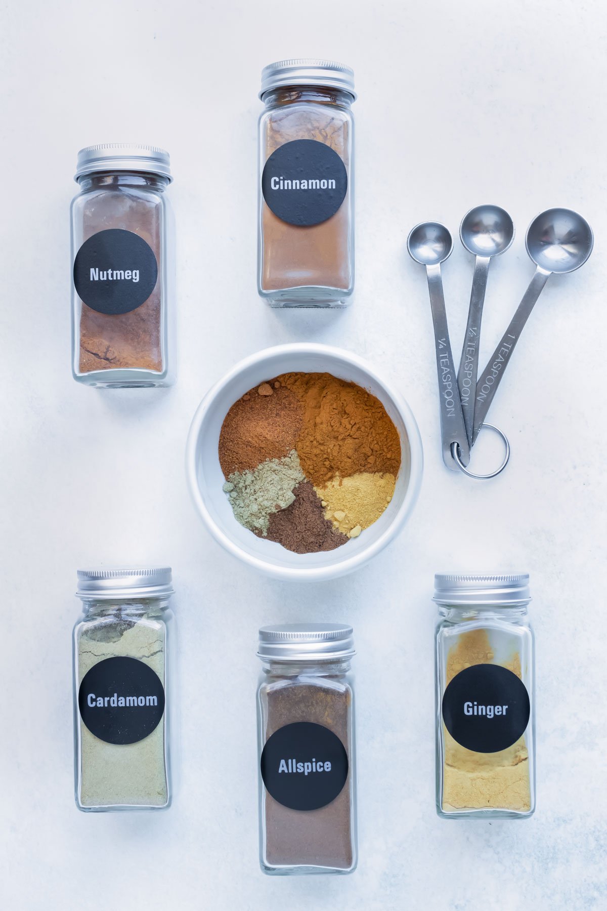 Ingredients in a DIY apple pie spice are cinnamon, nutmeg, cardamom, ginger, and allspice.