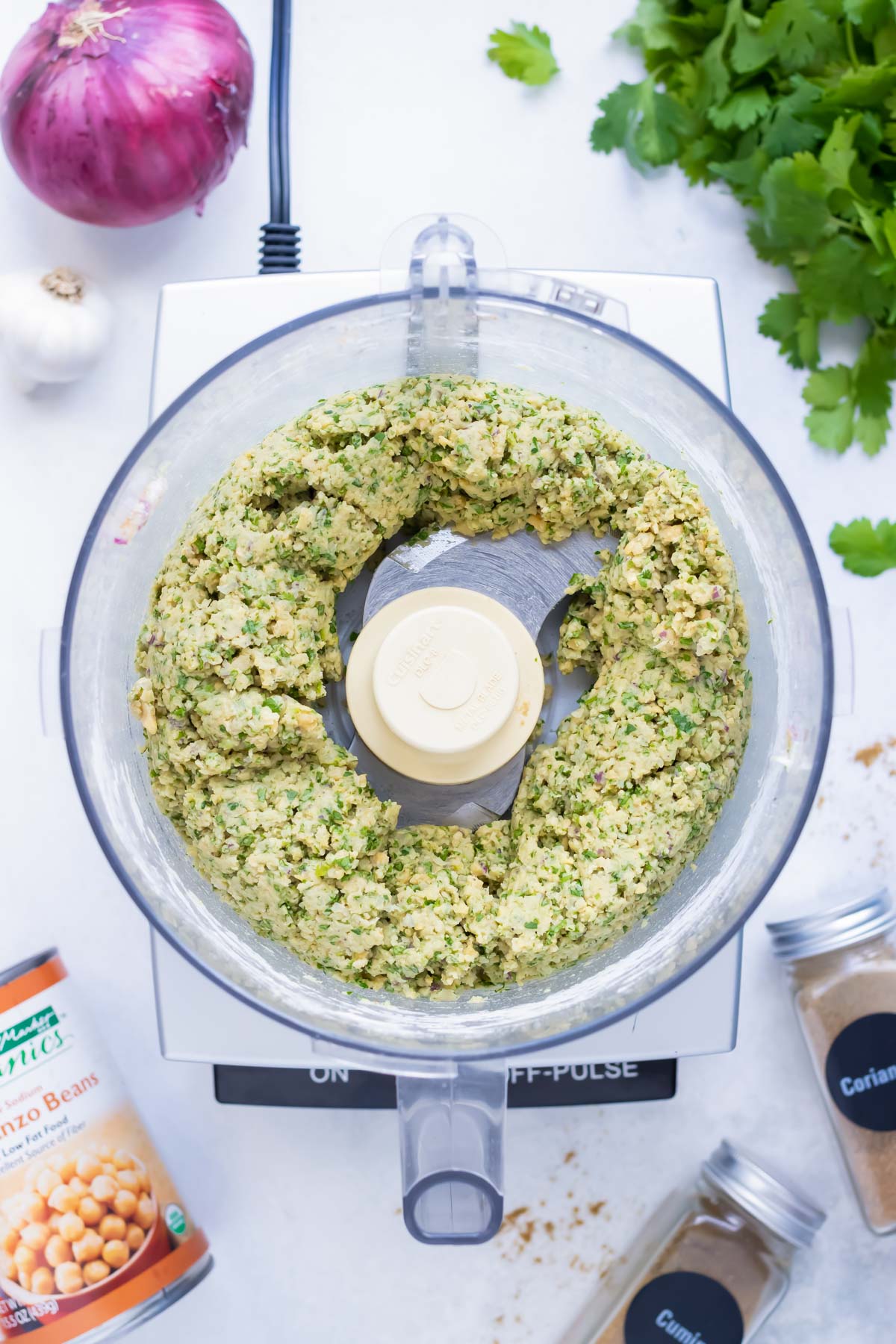 Pulse the ingredients 30-40 times to complete incorporate the ingredients in this falafel recipe.