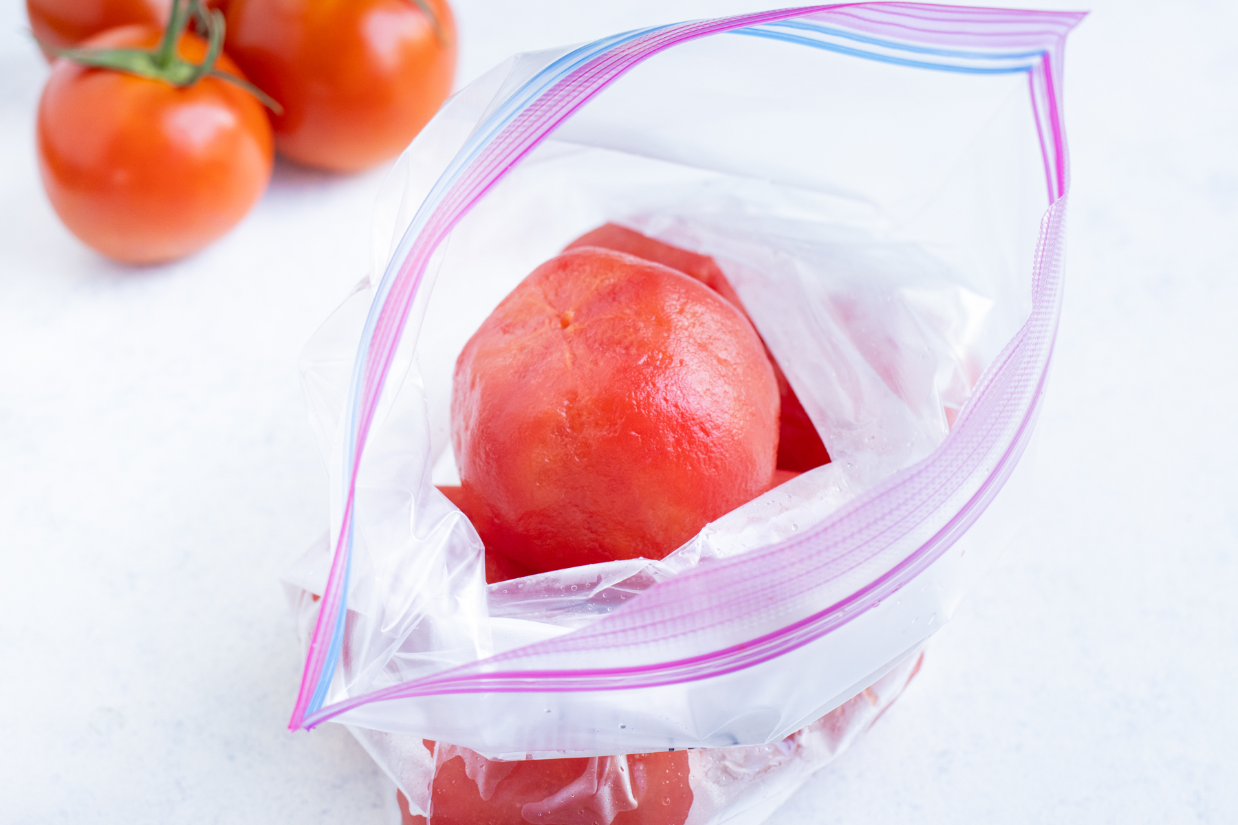 Bright, red tomatoes easily freeze for future use.