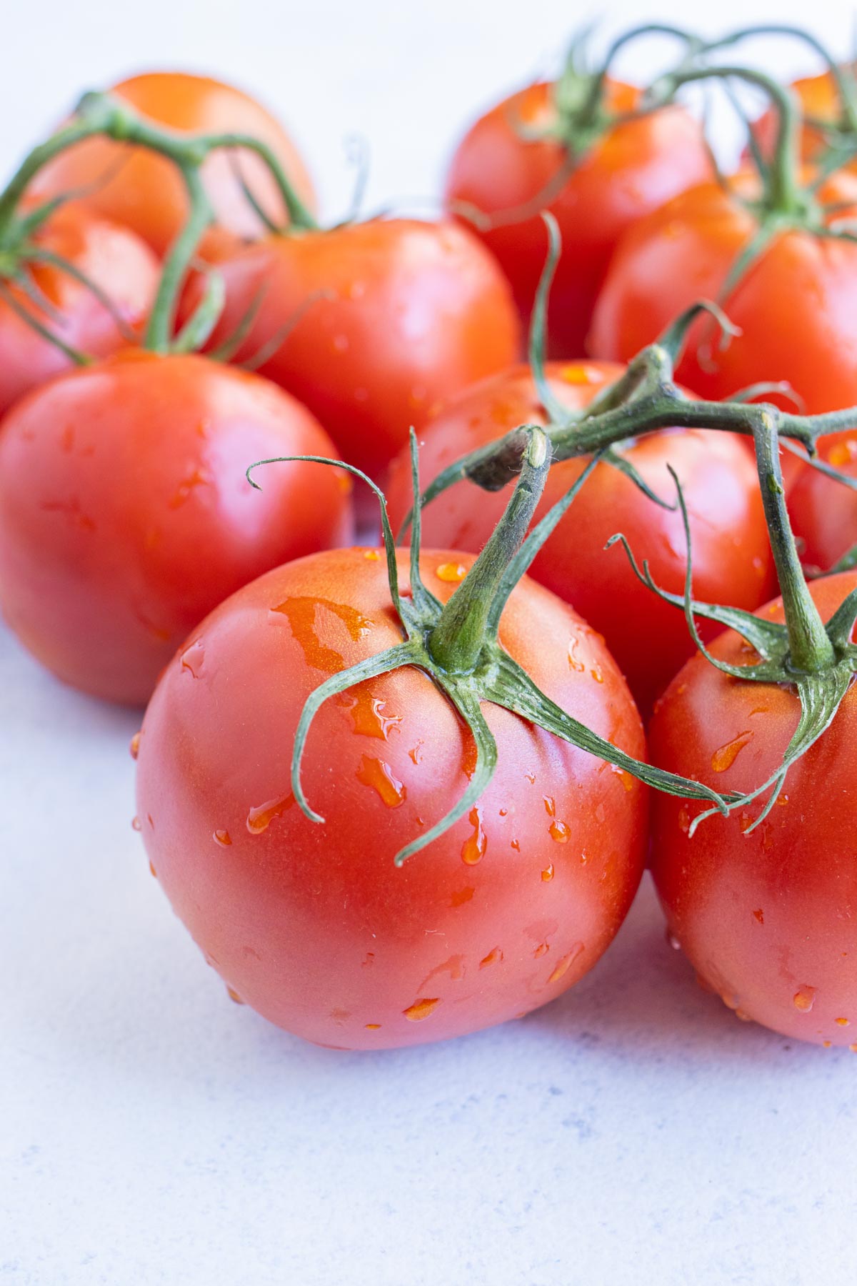 Ripe and fresh tomatoes in a bunch.