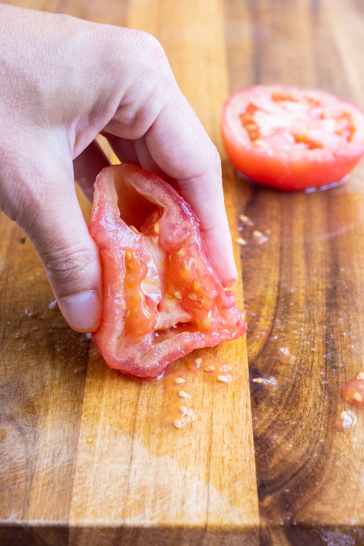 Removing the seeds from a tomato is simple.
