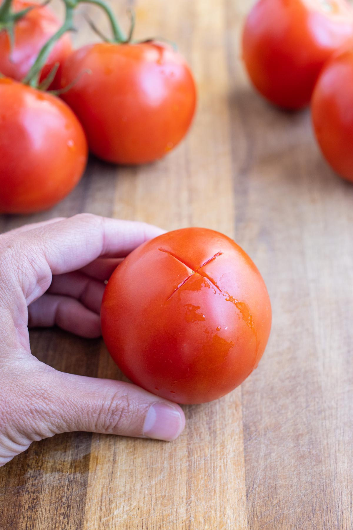 You can see an X on the bottom of the tomato.