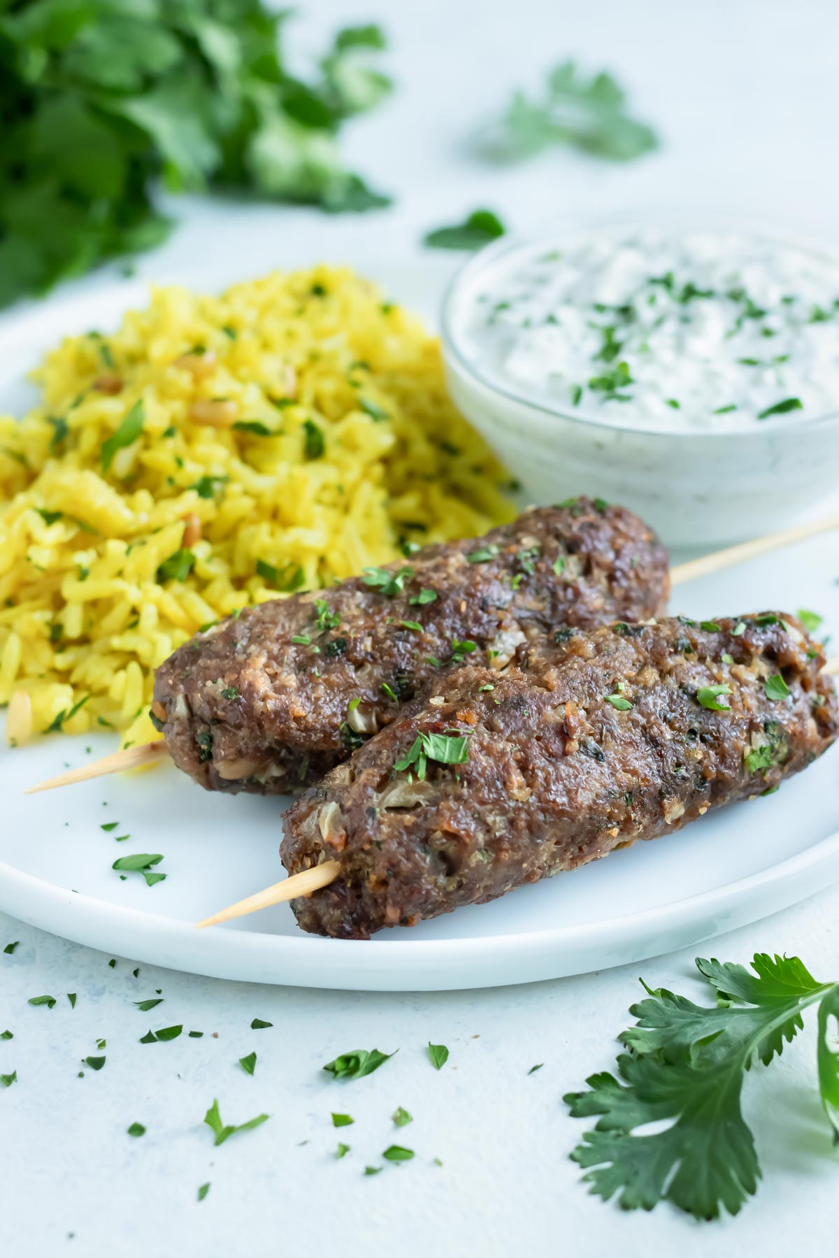 Yellow rice is served with Lamb Kofta for a healthy meal.
