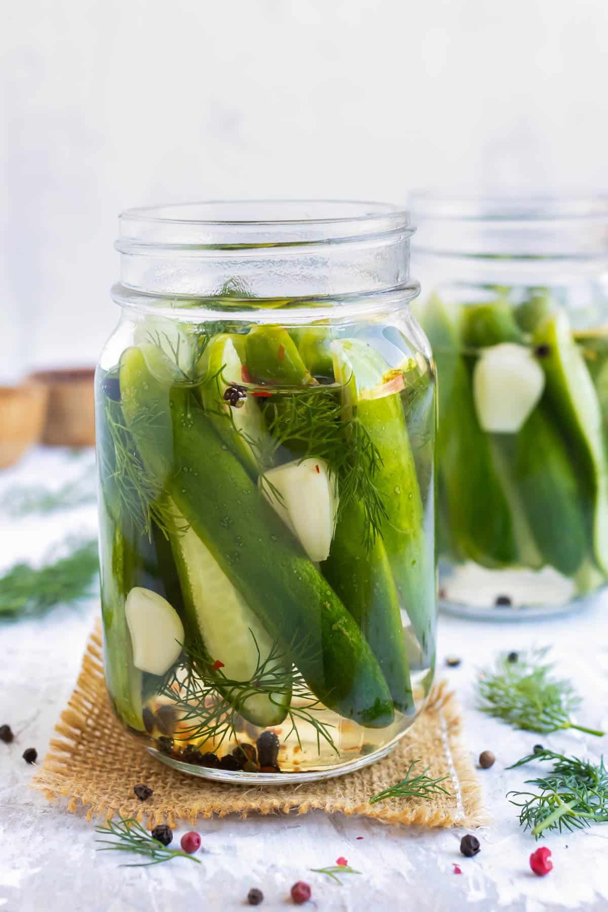 Overnight Refrigerator Dill Pickles RECIPE in a mason jar.