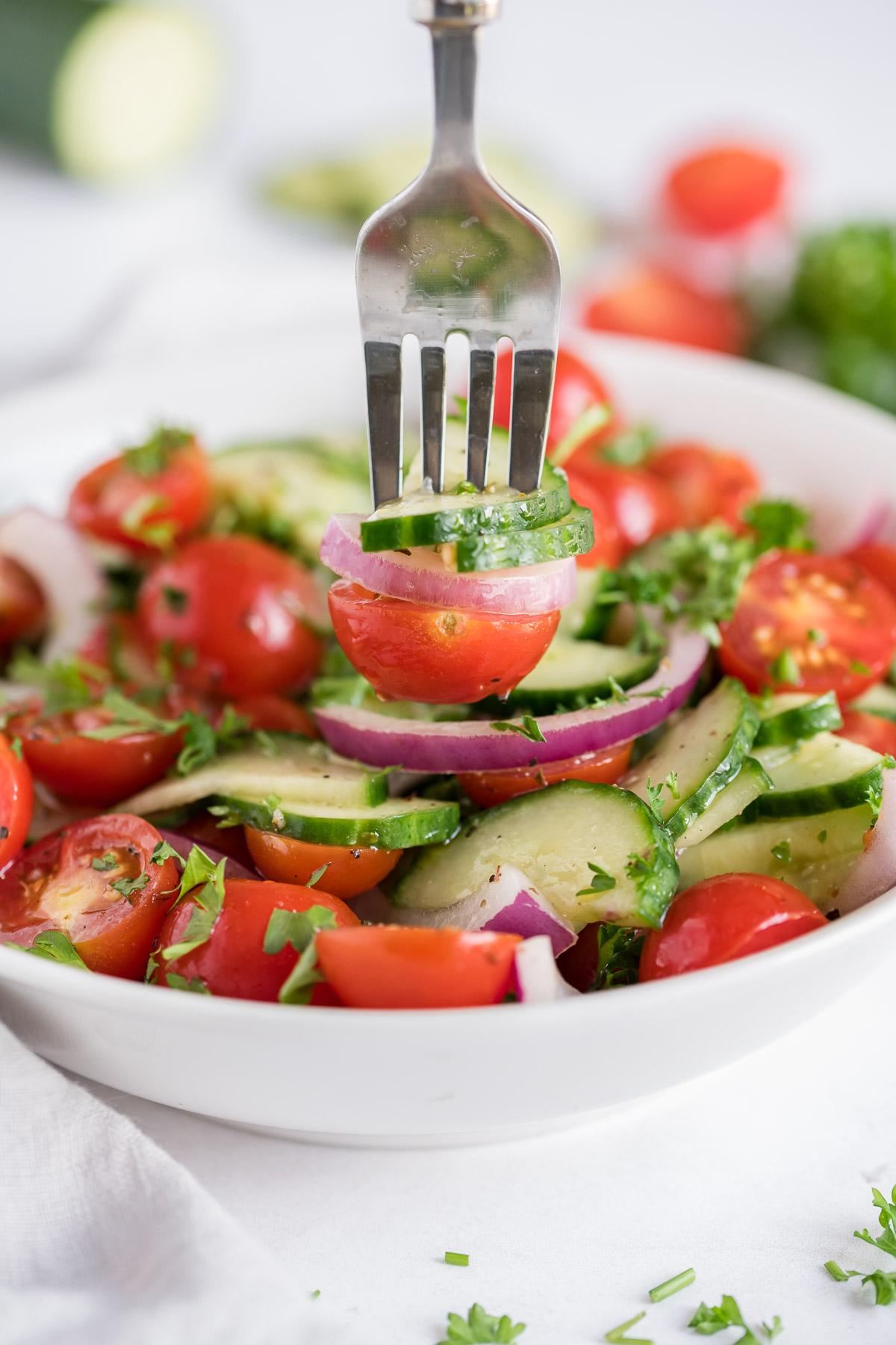 A fork picks out a serving of vegetable salad.