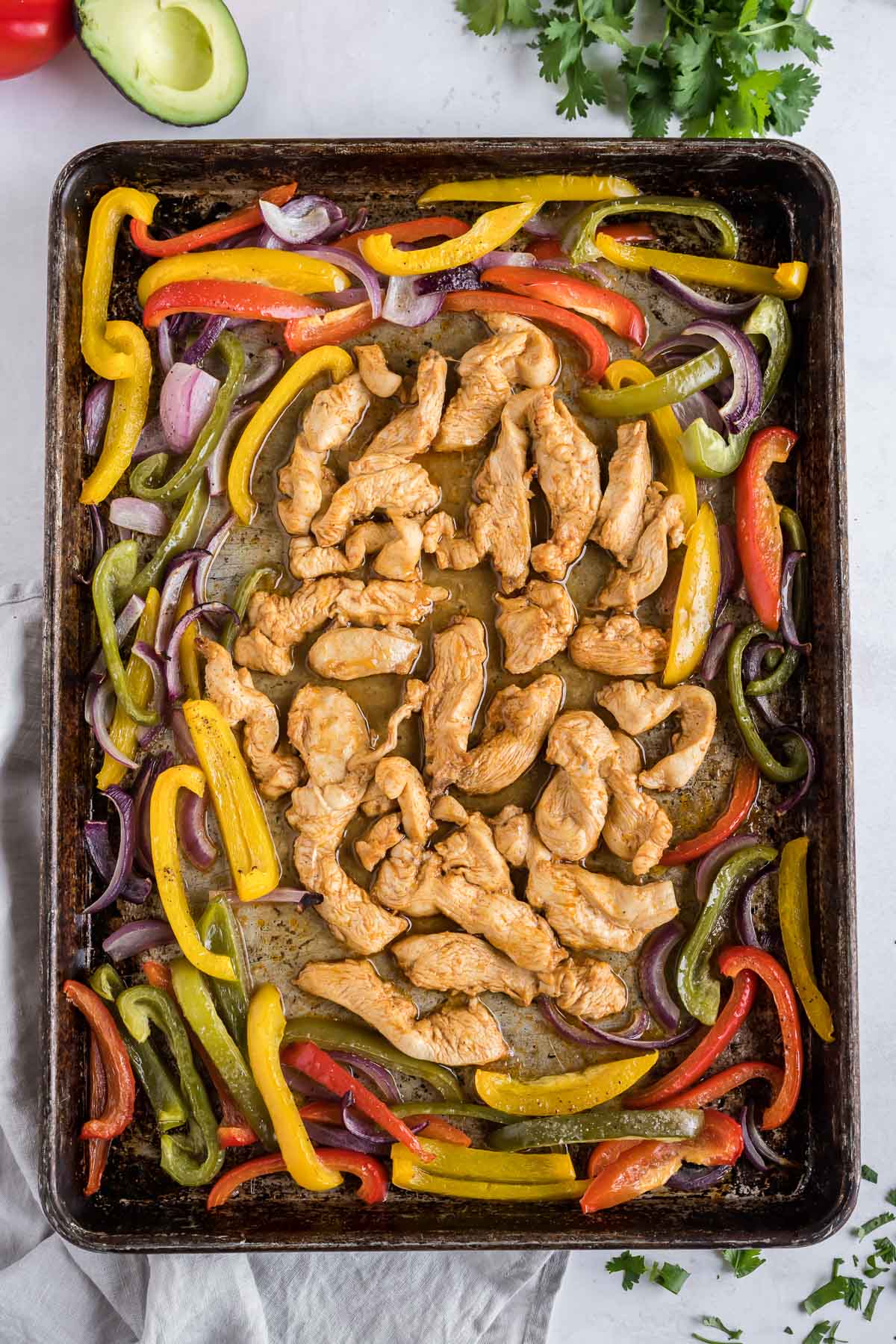 Lean chicken and healthy veggies are cooked together for fajitas.