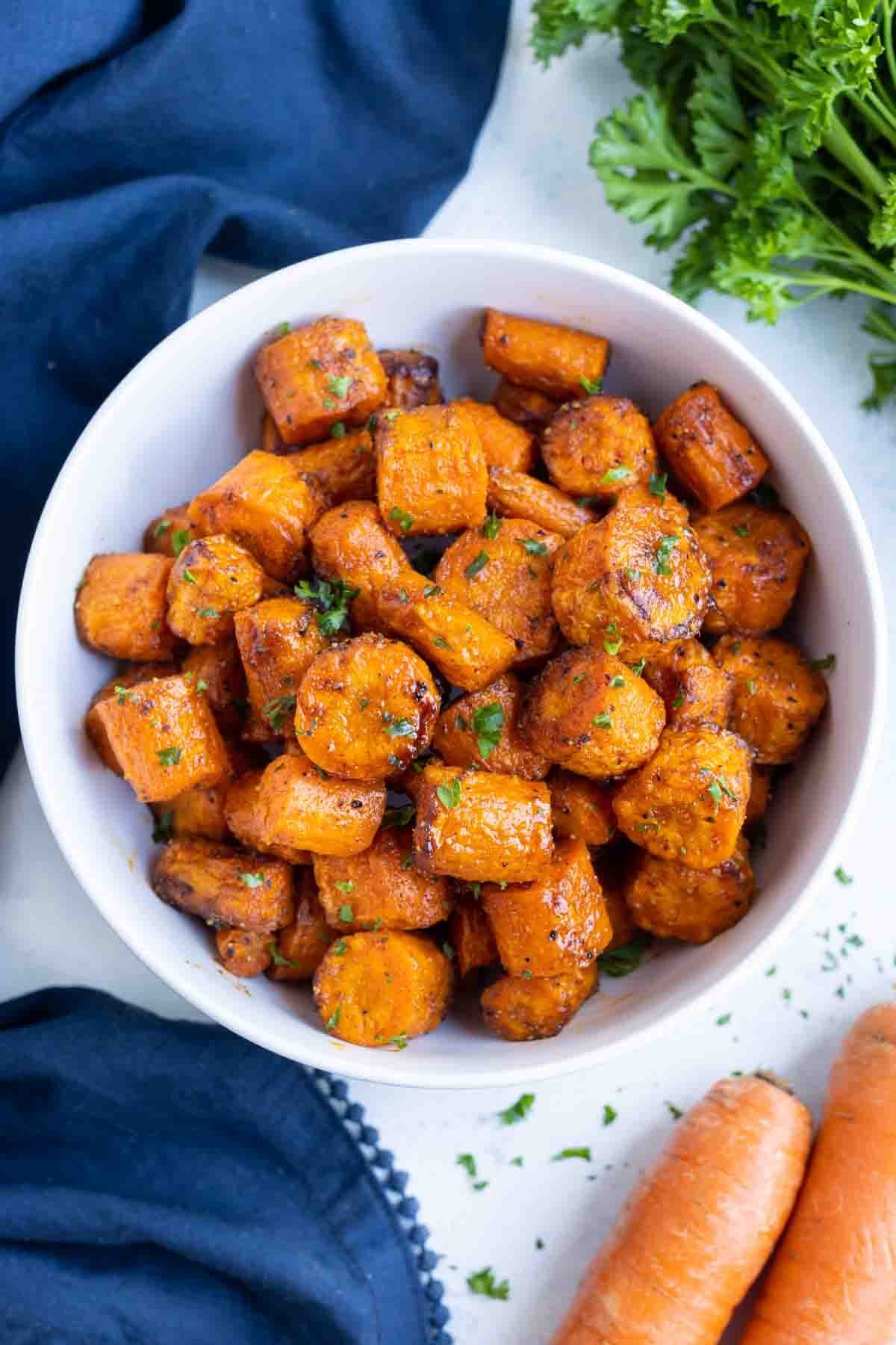 An overhead shot of air fryer carrots in a bowl.