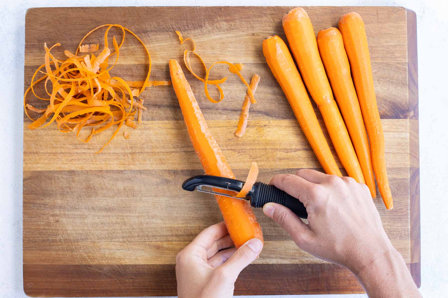 A peeler removes the skin from carrots.