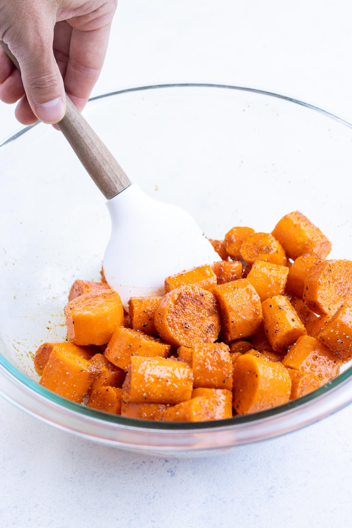 Carrots are covered with seasoning.