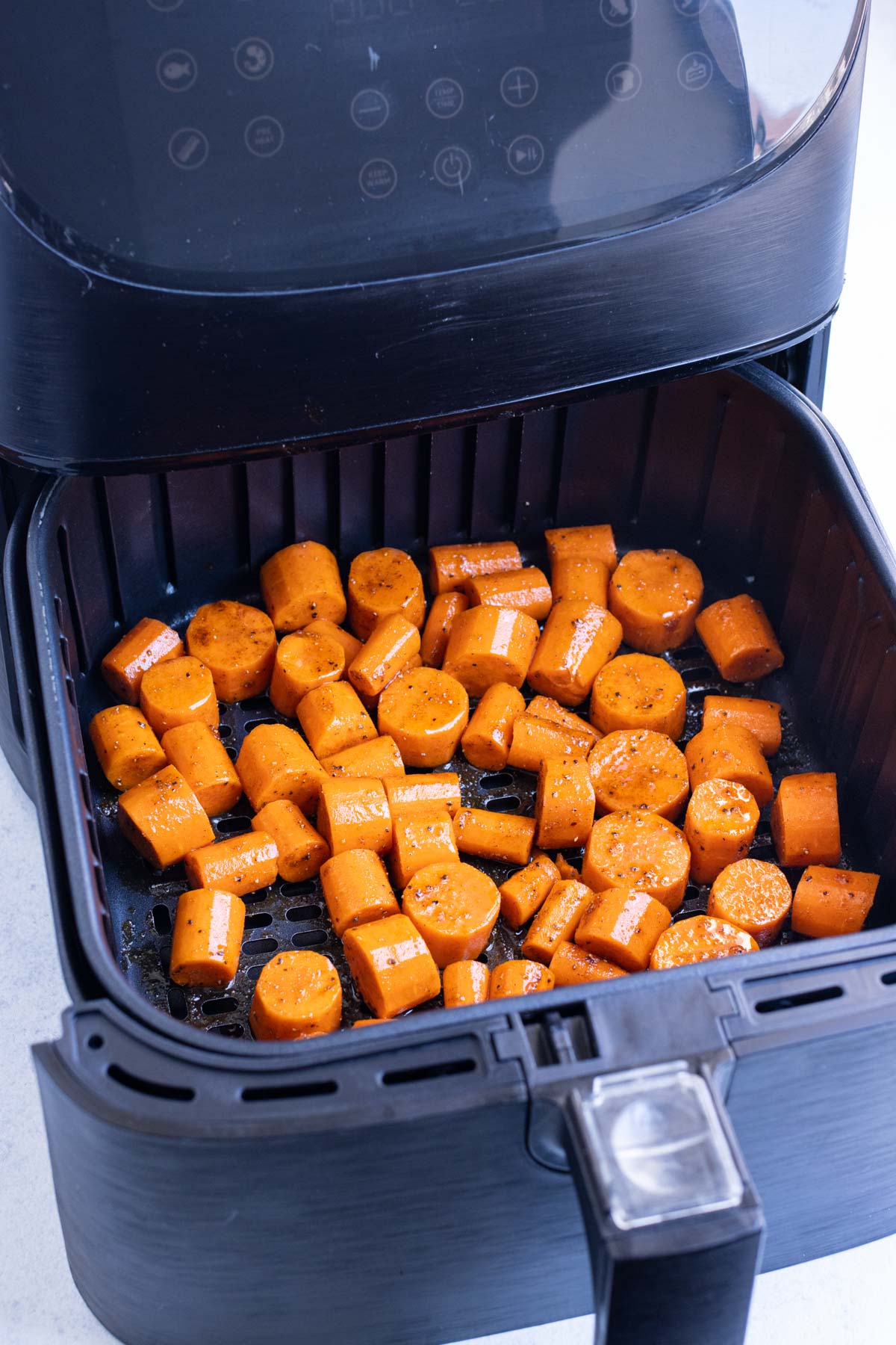 Carrots are cooked in an air fryer for an easy side.