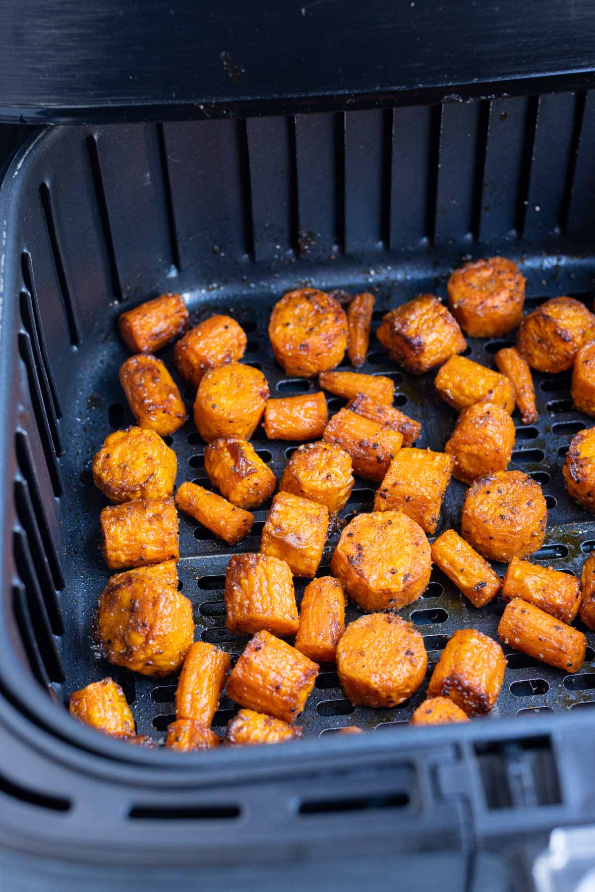 Carrots are seasoned with spices and cooked in half the time of the oven.