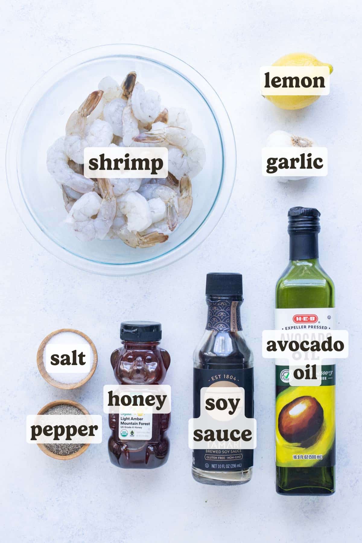 Shrimp, oil, soy sauce, honey, lemon, garlic, and seasonings are the ingredients for this air fryer shrimp recipe.