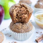 Fluffy apple muffins are made with applesauce, cinnamon and other healthy ingredients.