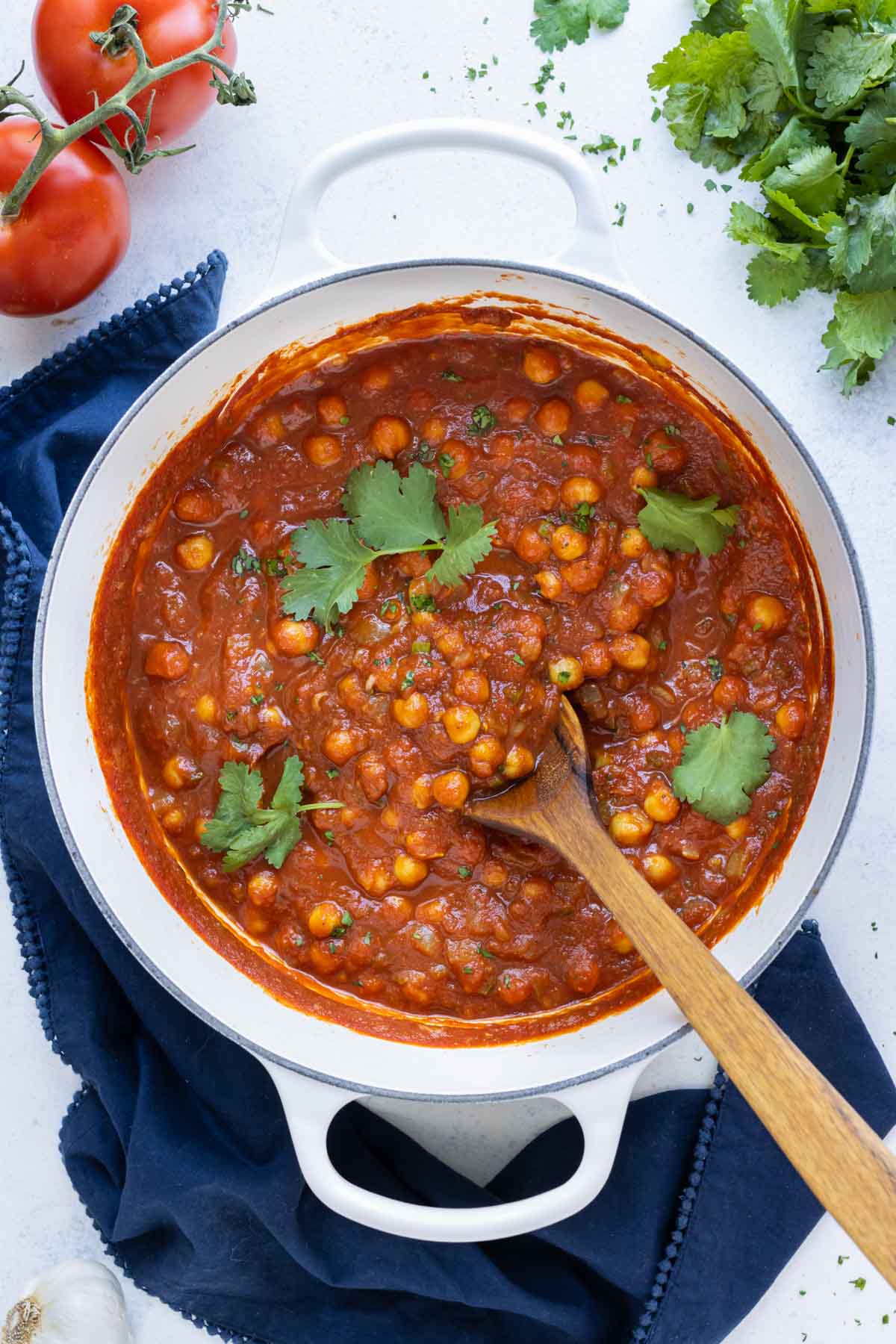 A pot full of savory and spicy chana masala.