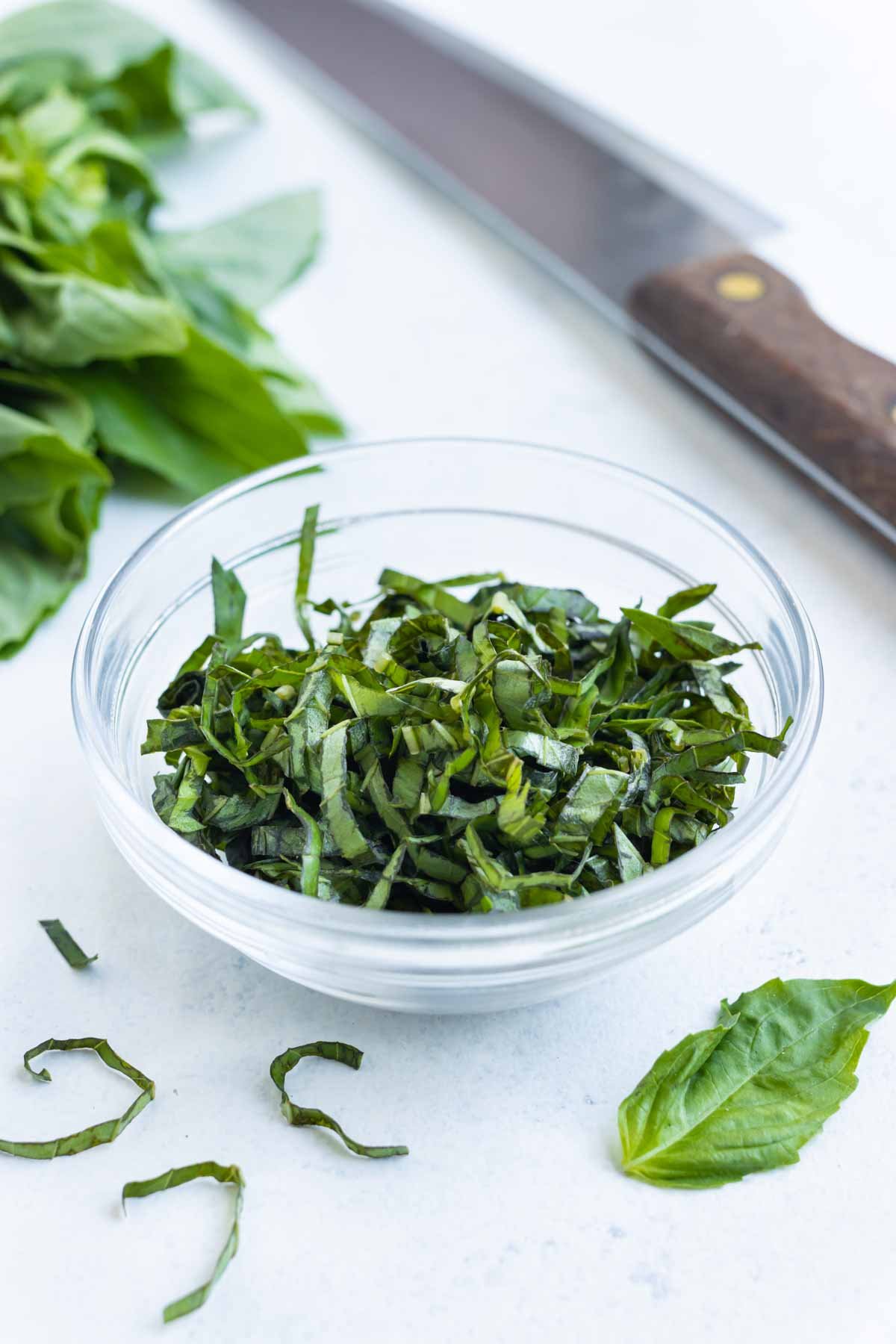 A bowl of basil cut into ribbons.