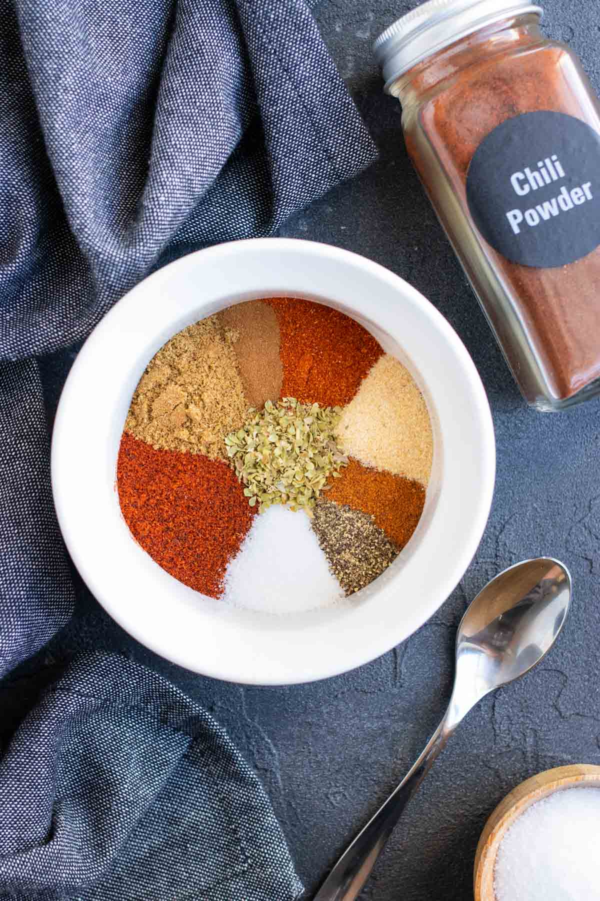 A white bowl full of the spices for a chili seasoning recipe.