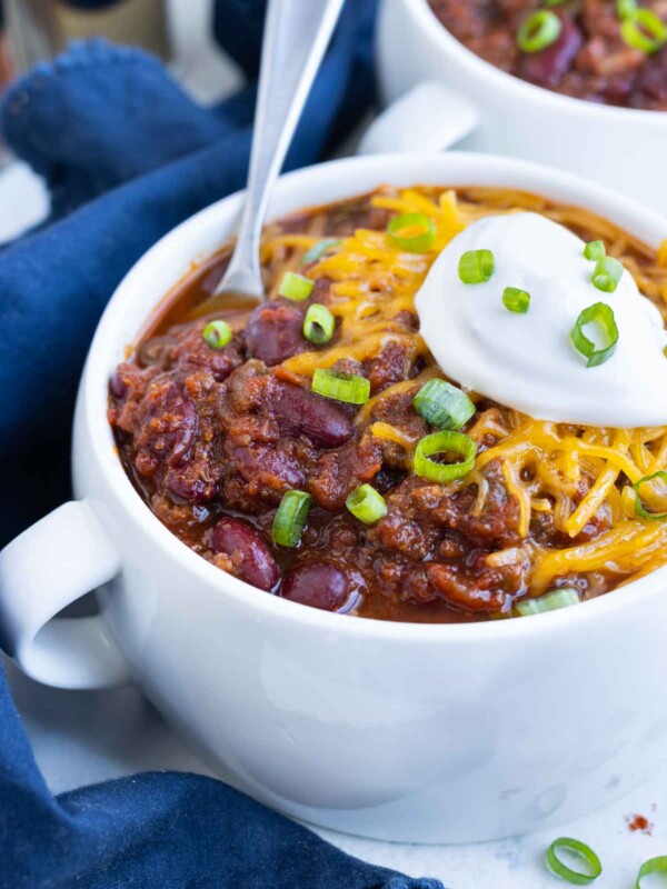 A white bowl full of chili is a healthy fall dish.