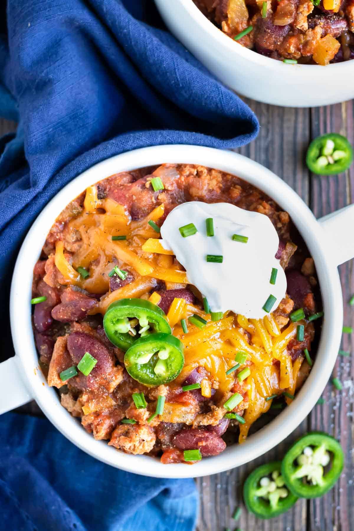A big bowl full of healthy ground turkey chili that is made in a pressure cooker.