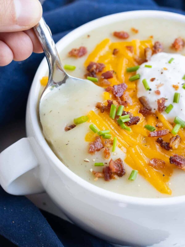 A spoonful of creamy potato soup.