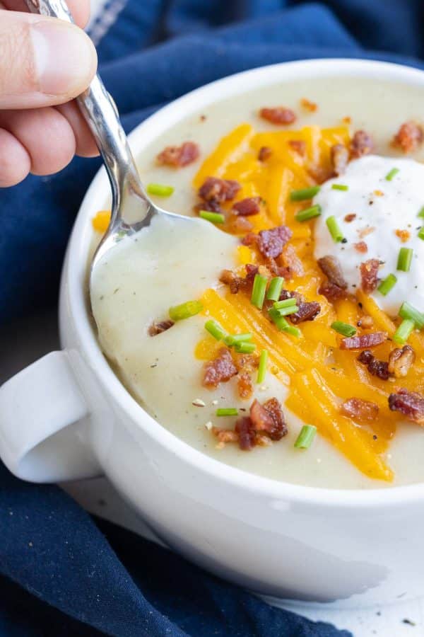 A spoonful of creamy potato soup.