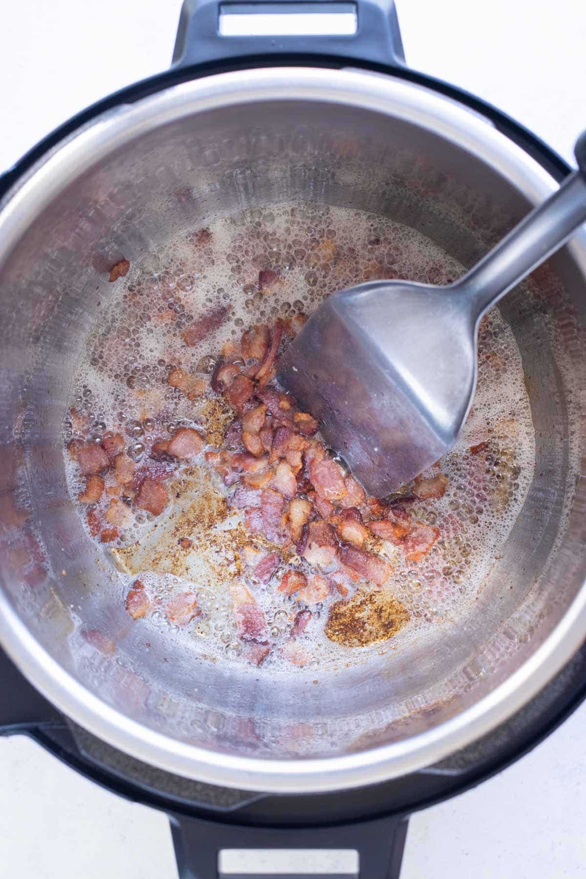 Bacon is sauteed in an Instant Pot.