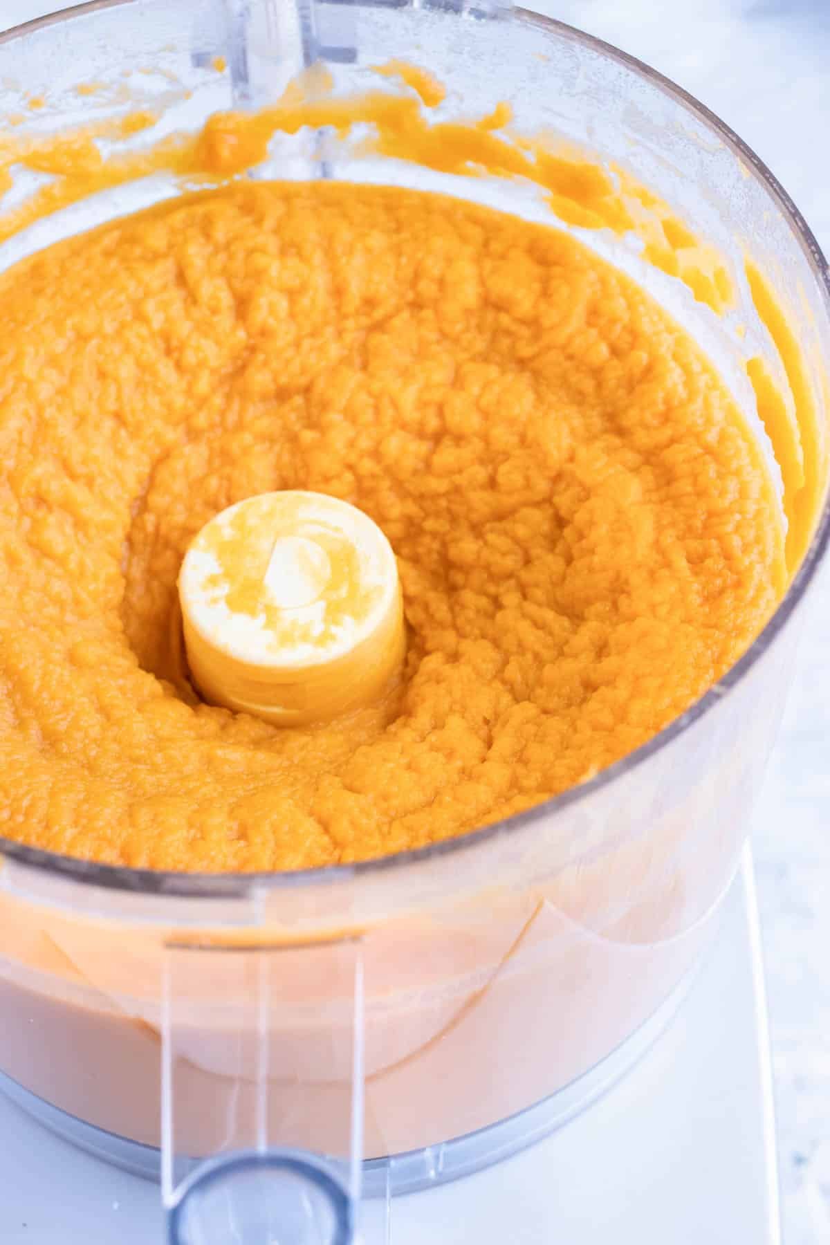 Mashed sweet potatoes in a food processor.