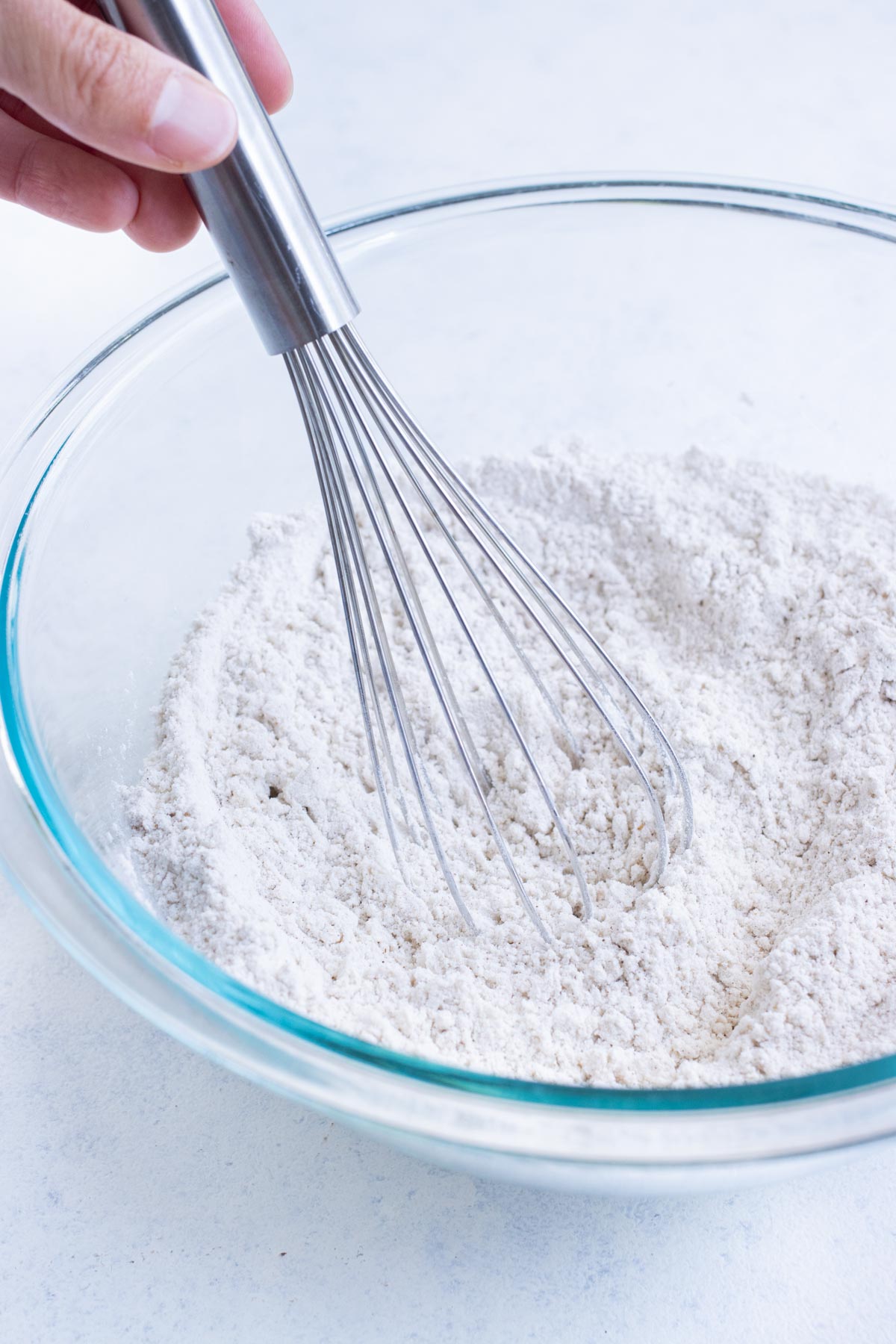 The dry ingredients are mixed together in a bowl.