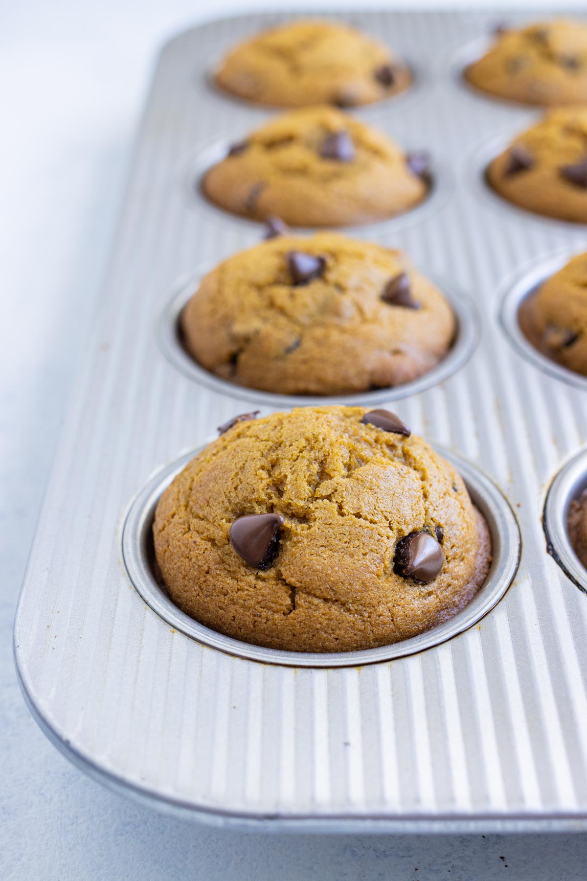 Muffins are done when the tops are rounded and they are golden in color.