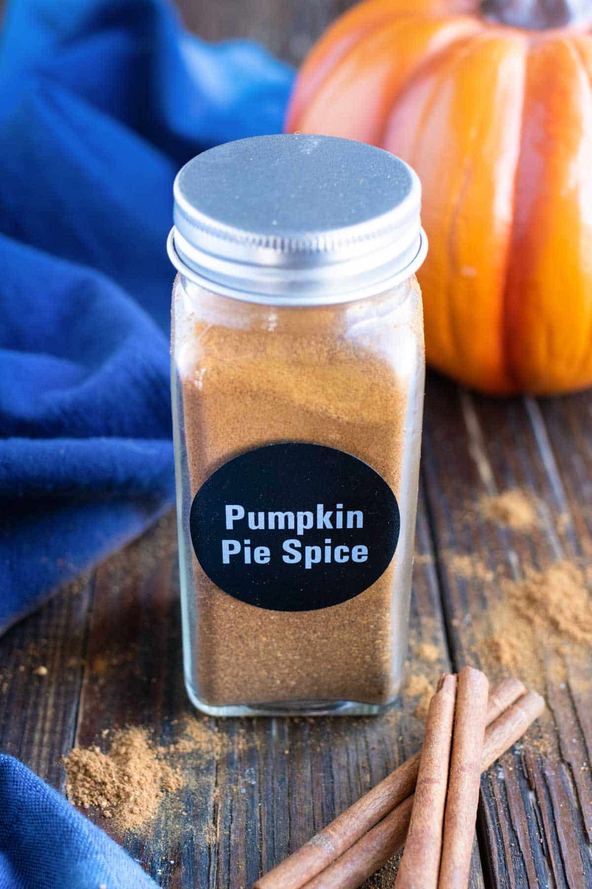 A spice jar full of DIY pumpkin pie spice.