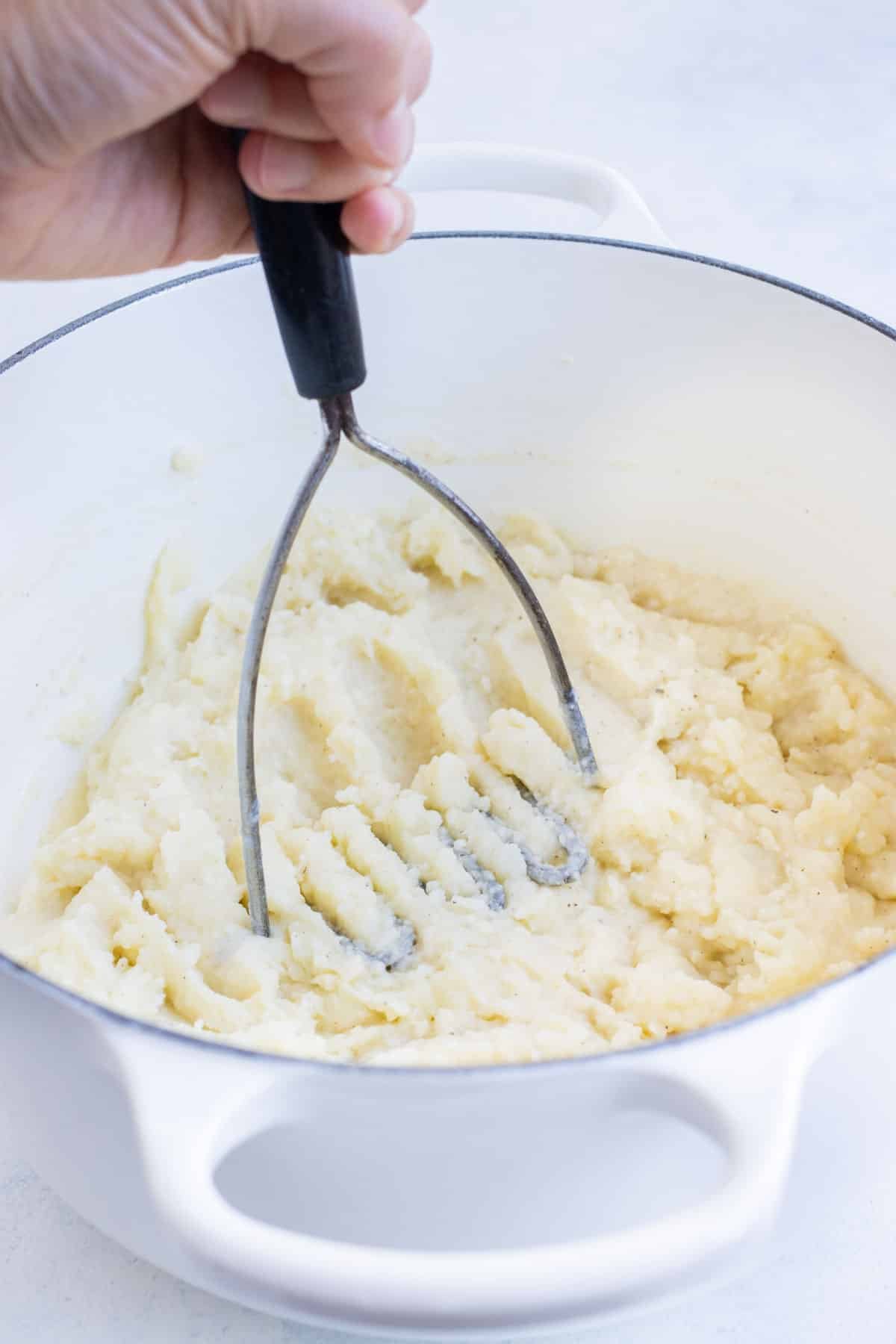 A potato masher mashes potatoes.
