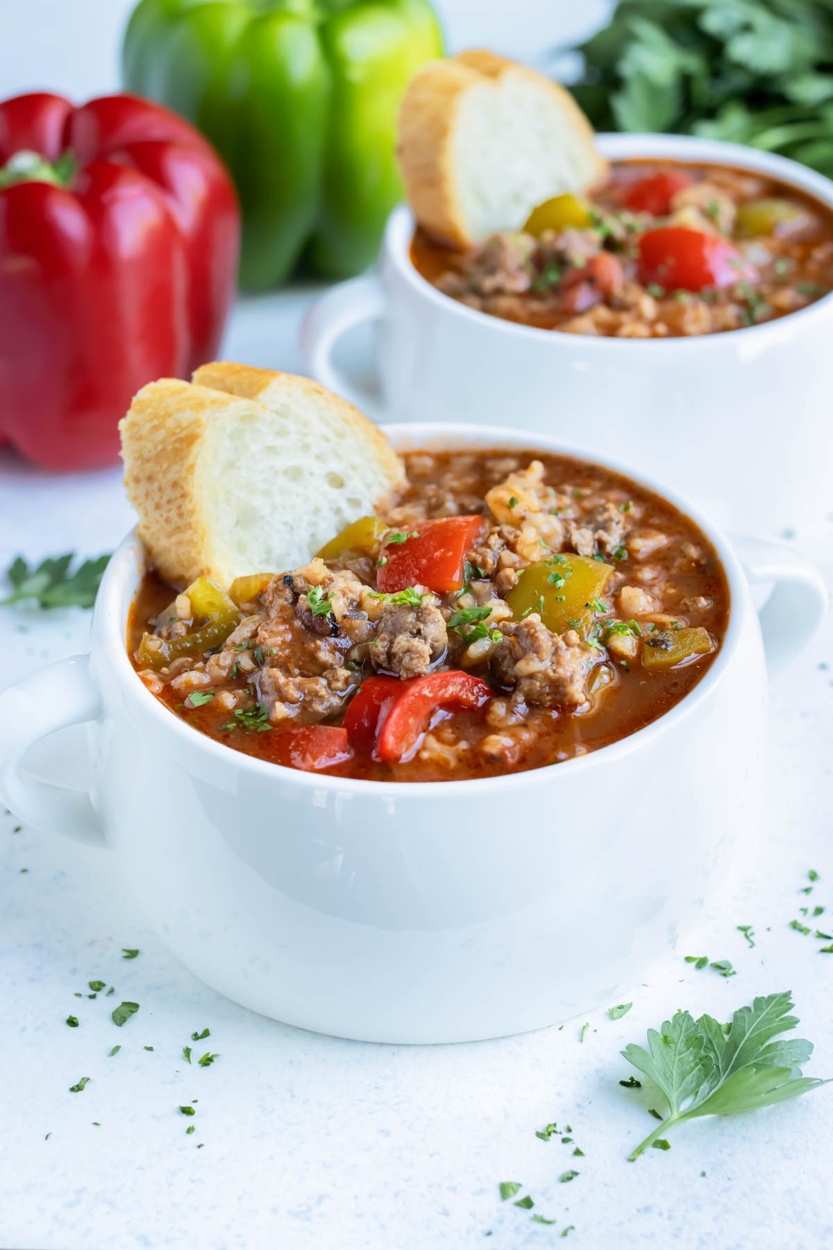 Bread is served with this hearty bell pepper soup.