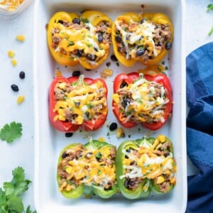 Taco stuffed bell peppers are shown on the counter.