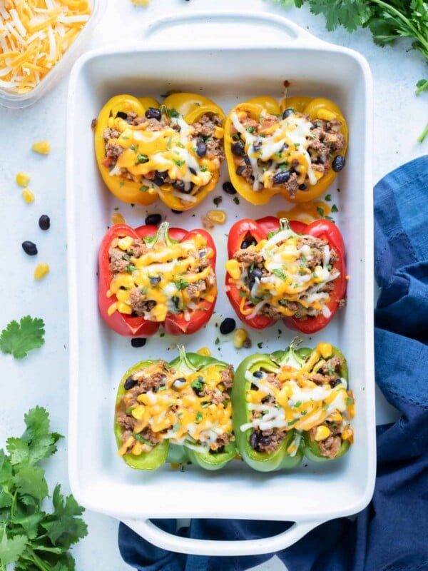 Taco stuffed bell peppers are shown on the counter.