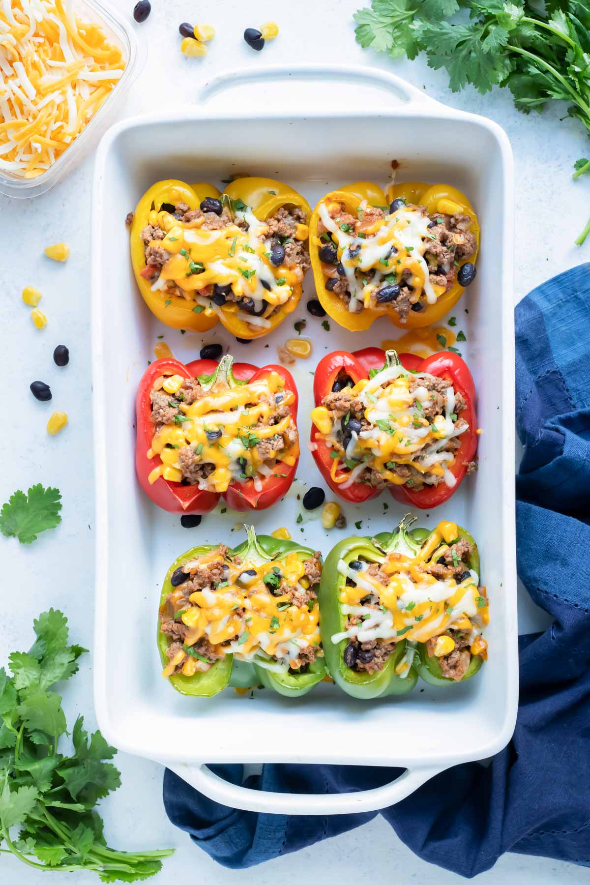 Taco stuffed bell peppers are shown on the counter.