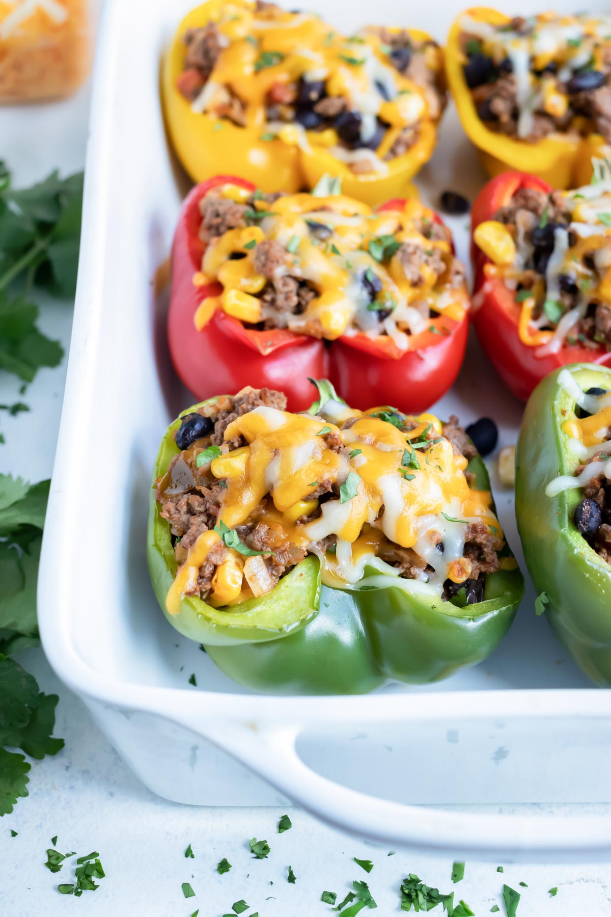 Low-carb Stuffed Bell Peppers are served for a main dish with taco flavors.