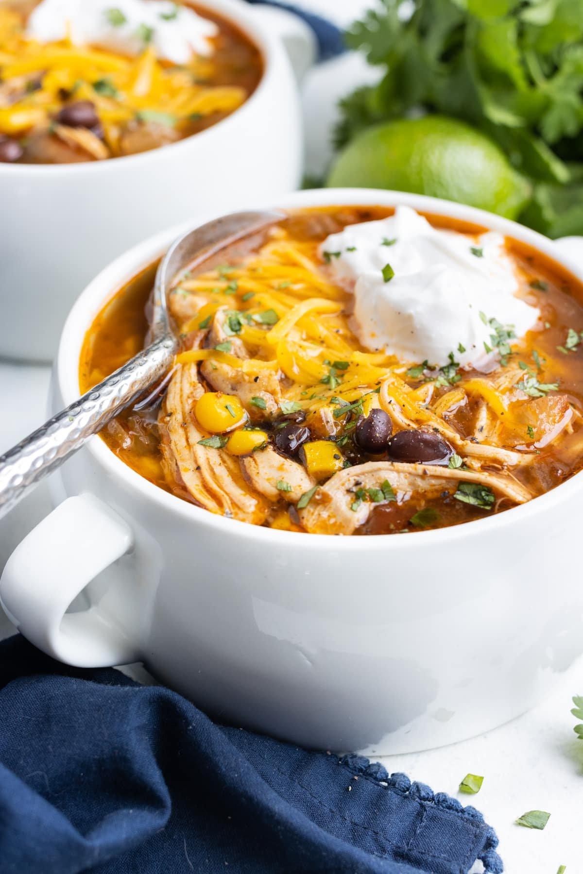 Sour cream and cheese are the perfect toppings for chicken taco soup.