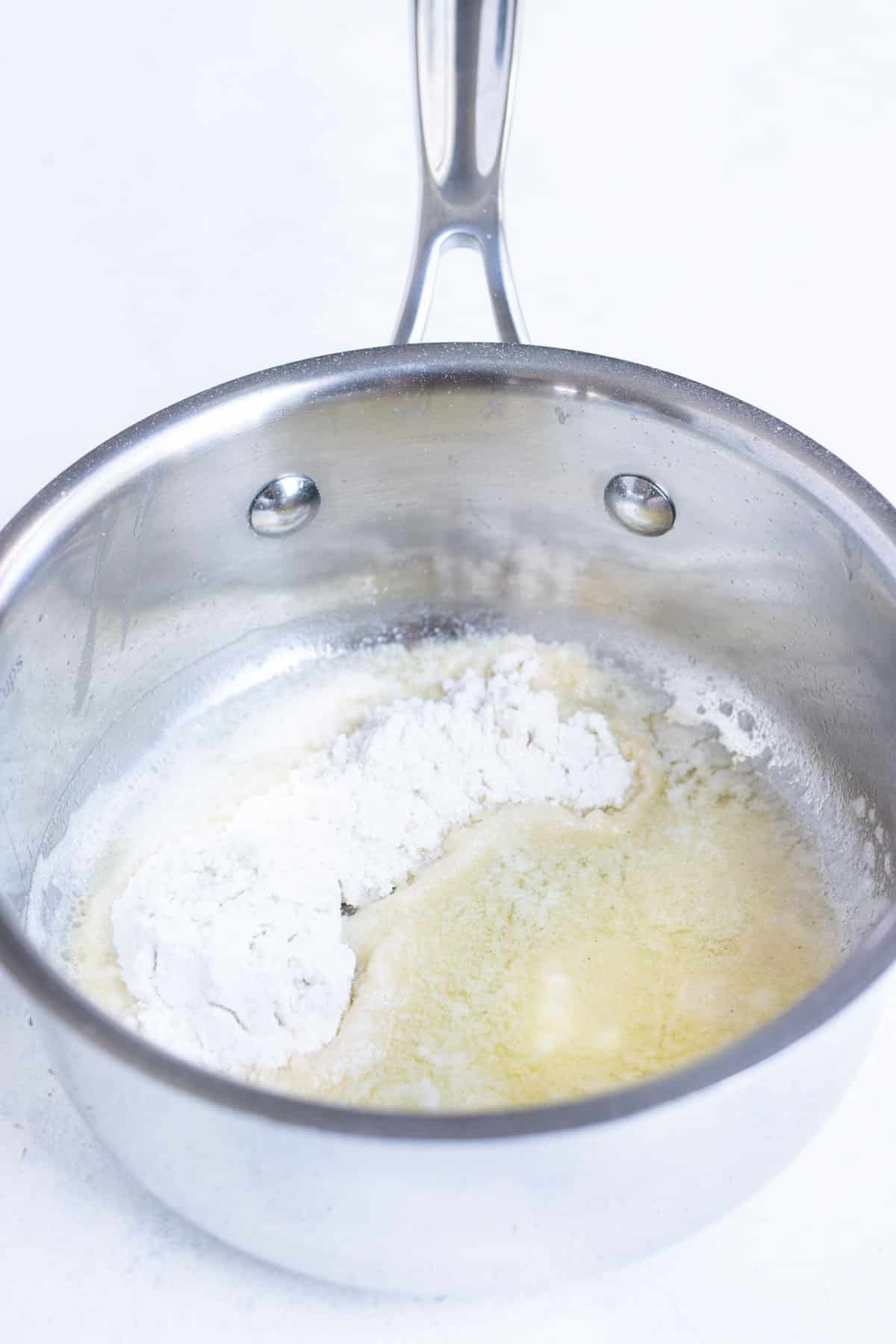 Butter and flour come together to make a roux.