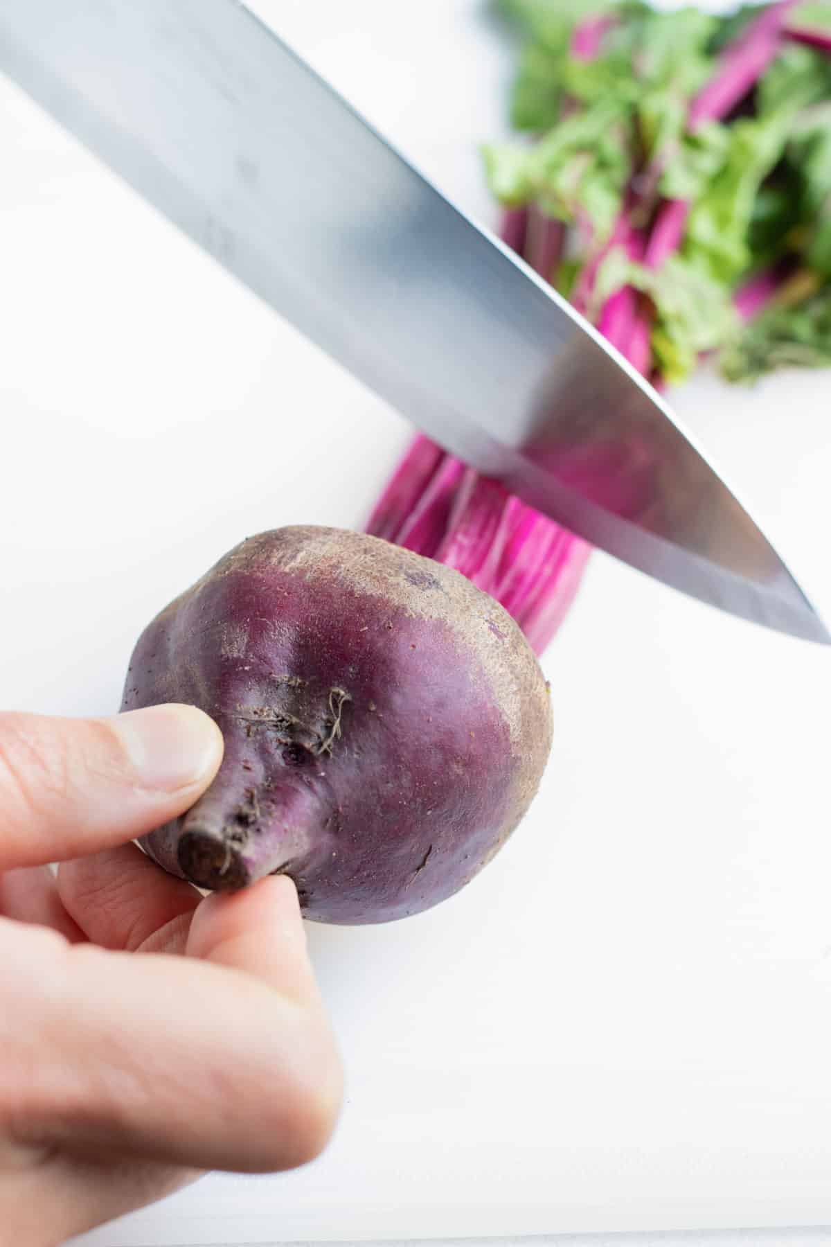 The stem is chopped off the whole beet.