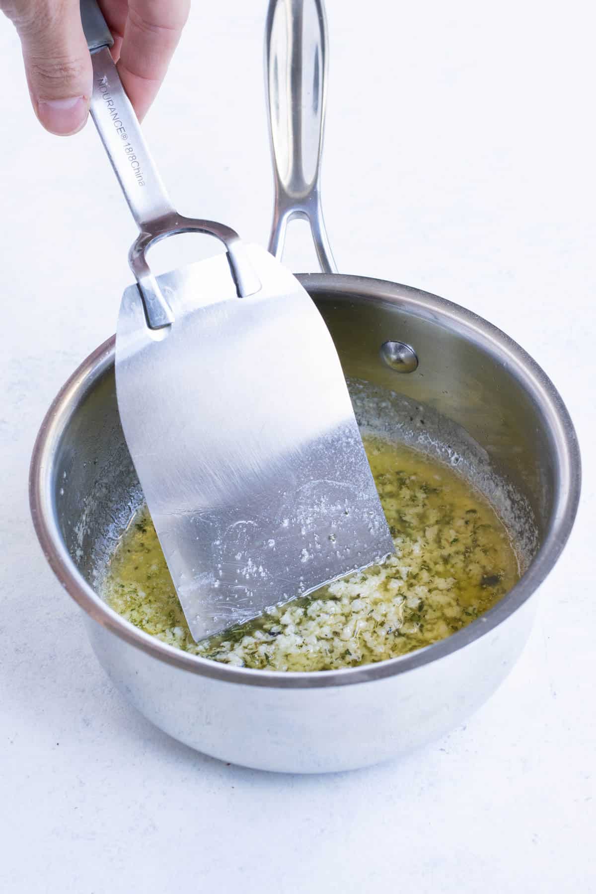 Butter is infused with garlic and herbs.