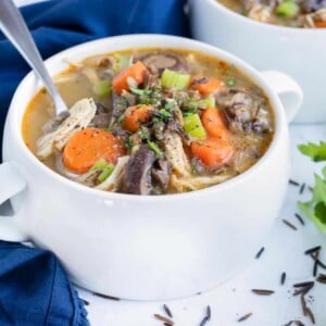Easy chicken wild rice soup is full of carrots, mushrooms, shredded chicken, savory flavors, and wild rice.