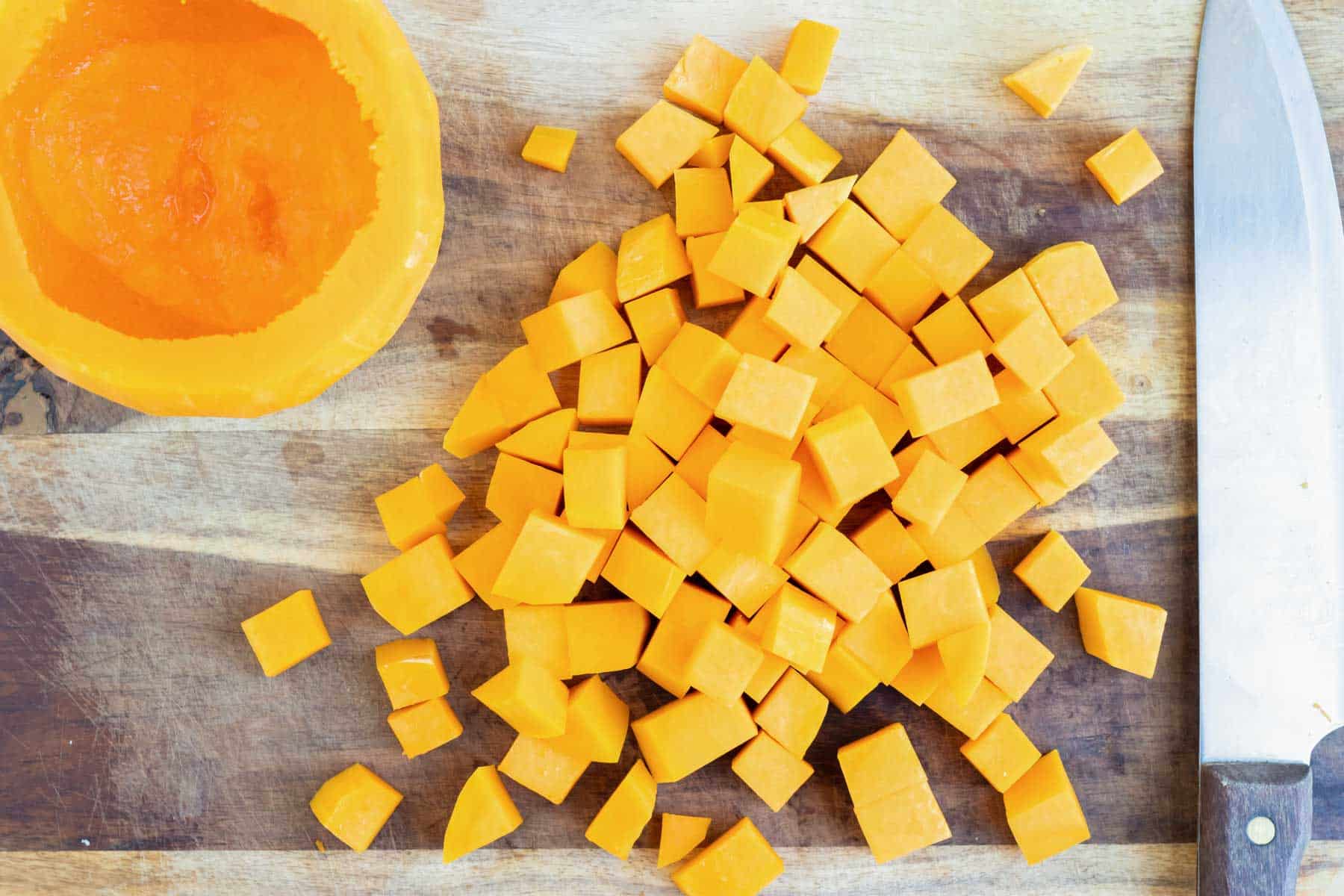 Cubed butternut squash on a cutting board.