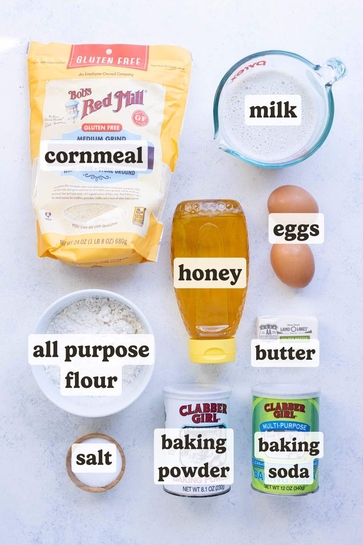 Medium grind cornmeal, all purpose flour, milk, eggs, and honey are the ingredients needed for a mini cornbread muffin recipe.