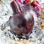 Roasted beets are unwrapped and ready to be peeled.