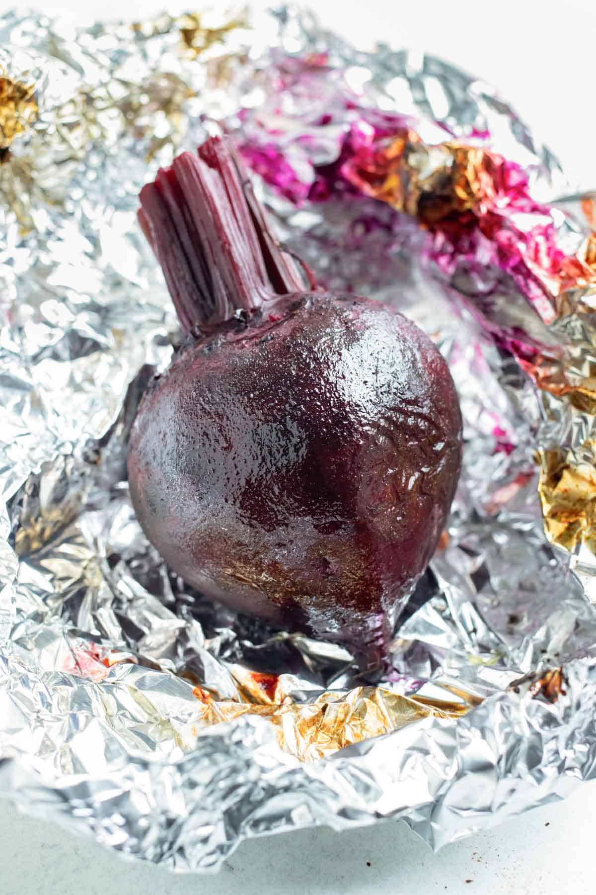 Roasted beets are unwrapped and ready to be peeled.
