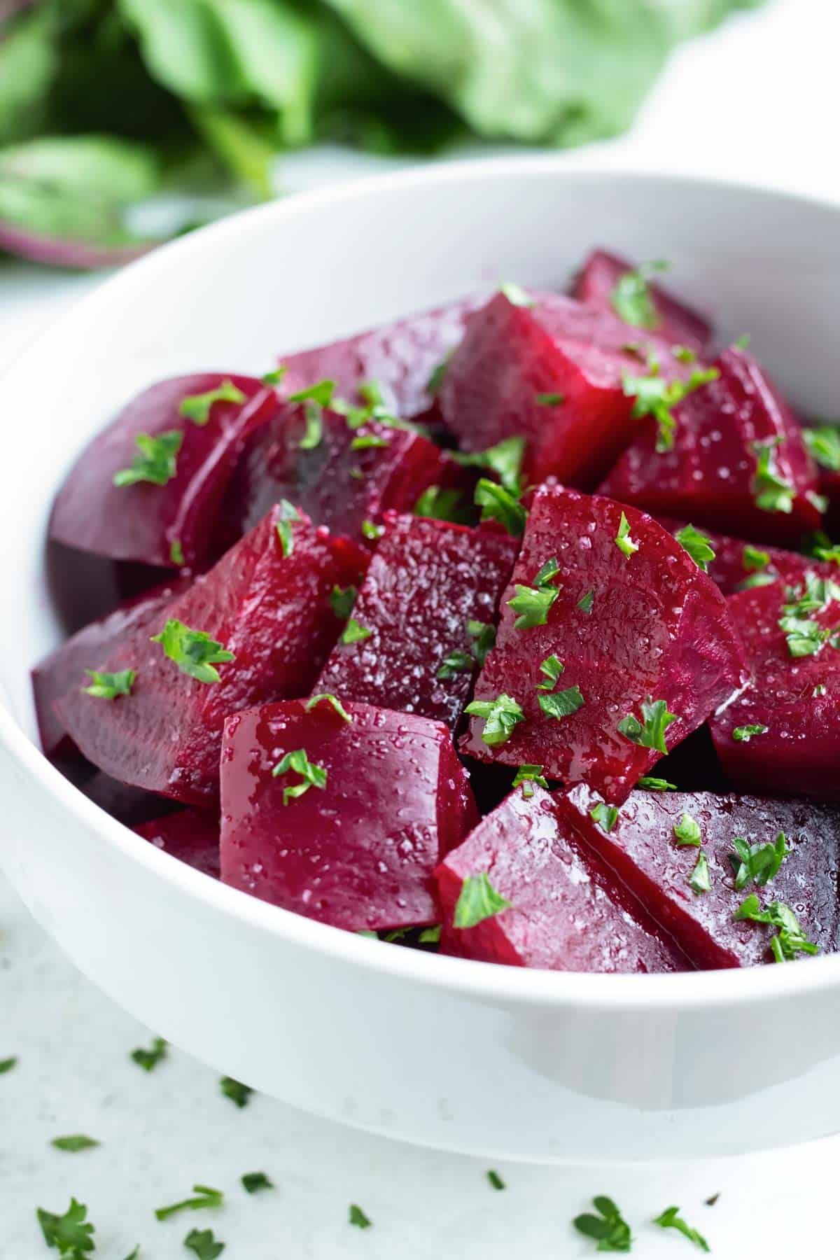 Roasted beets are peeled and chopped before using in recipes.