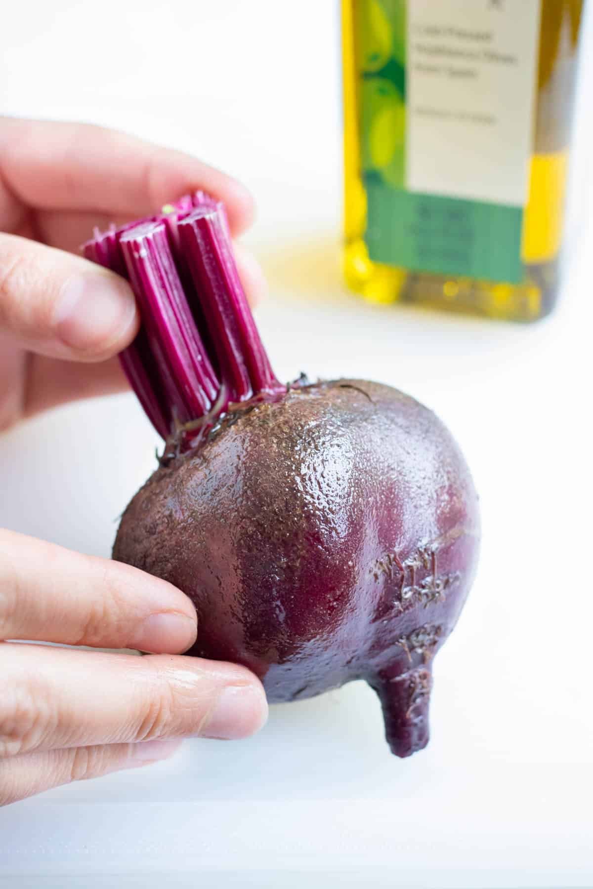 Olive oil is rubbed all over the beets.